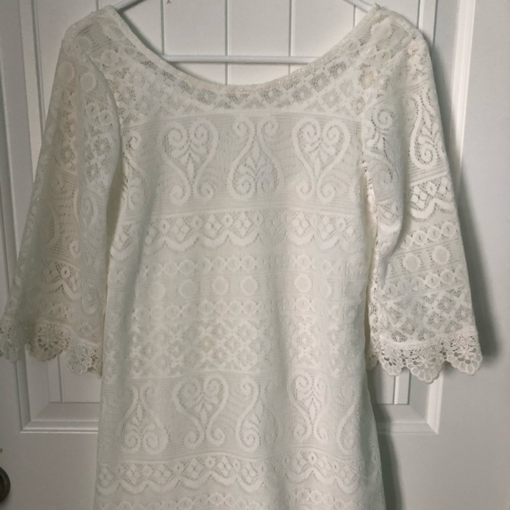 White lace mini dress with 3/4 sleeve length